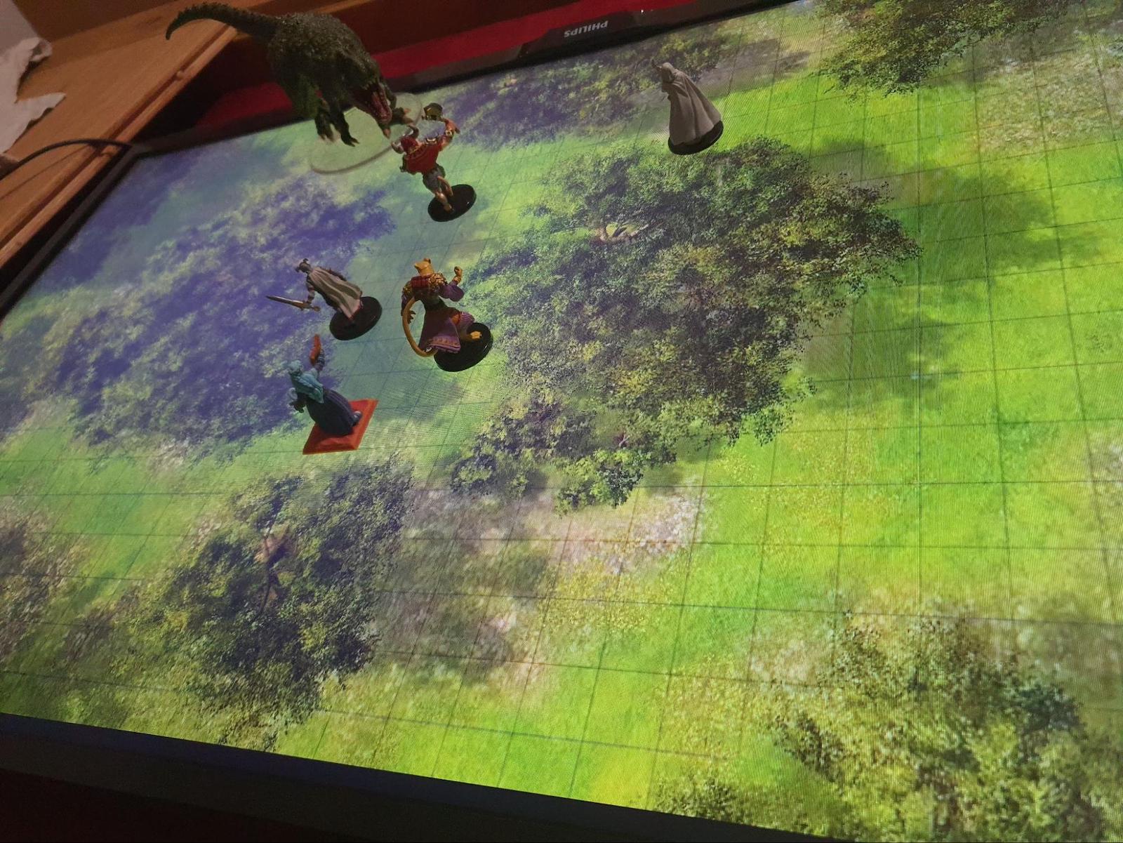 Battle map on a TV lying on a table, from a Dungeons & Dragons game